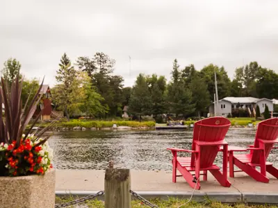 Muskoka chairs overlooking the water in Coboconk