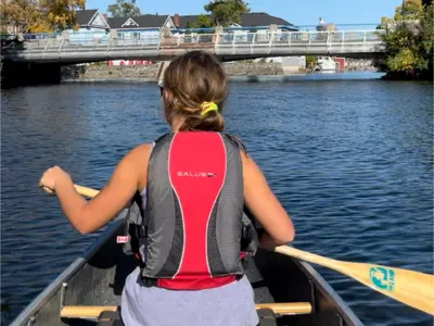 Girl paddling through Bobcaygeon 