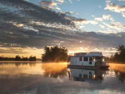 Houseboat on the water at dusk